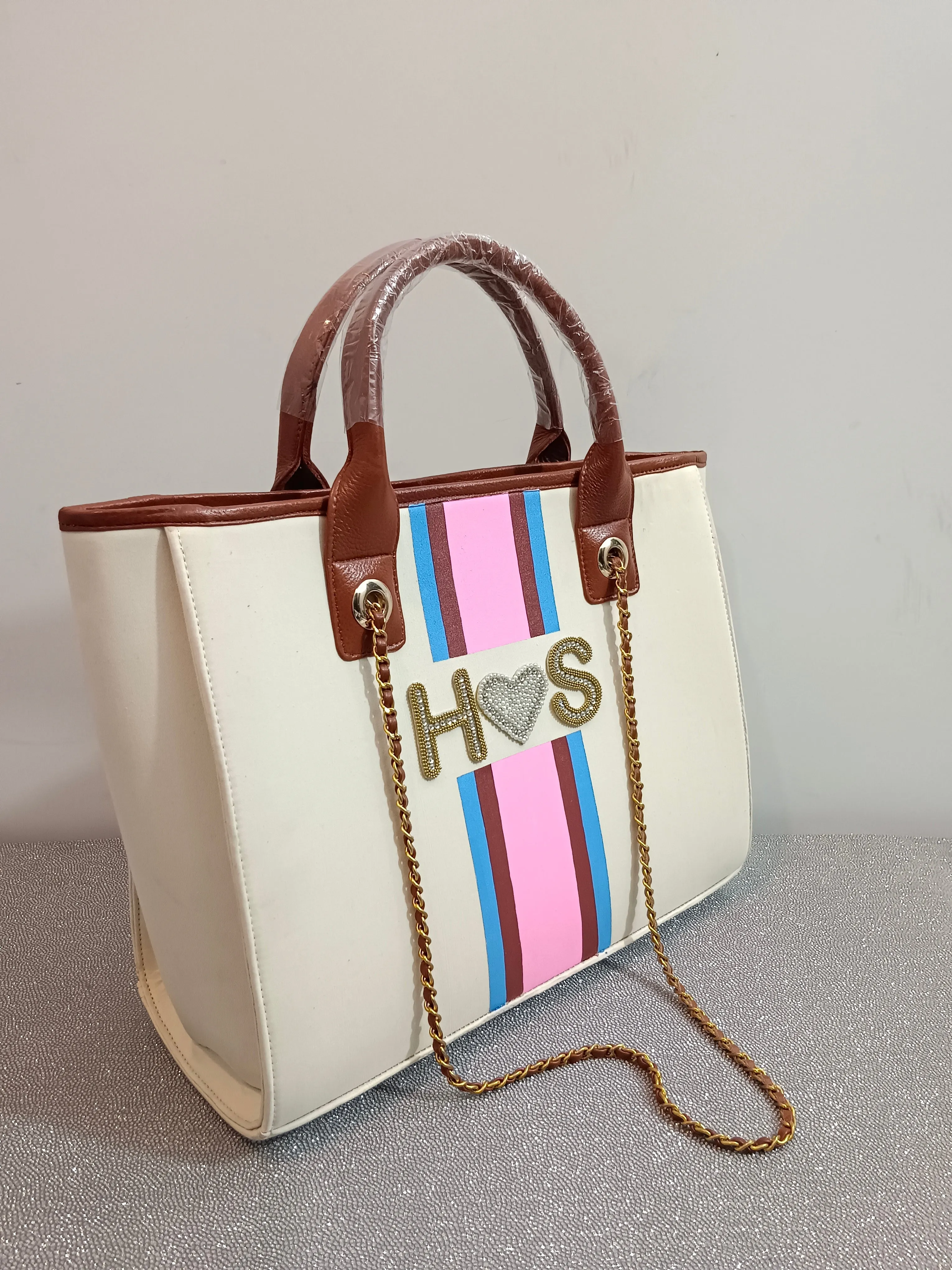 Off-white bag with embellished name